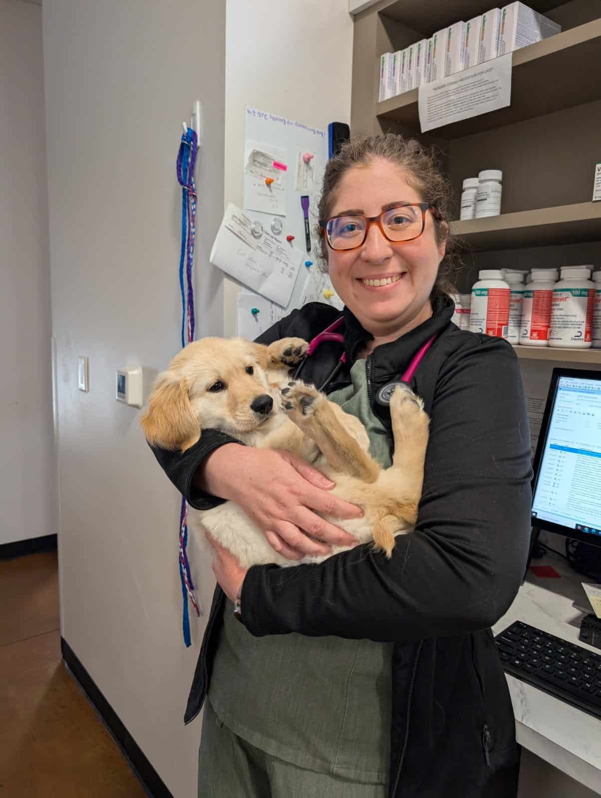 Dr. Cooper holding a puppy